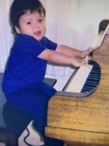 Playing piano at my Aunt's house when I was a toddler.